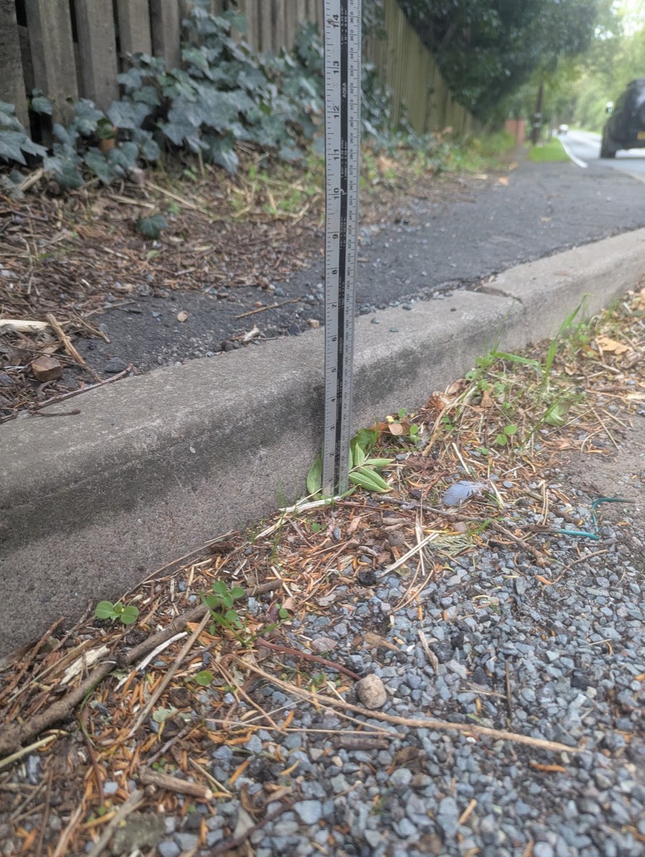 Rule on the ground at the footway end beside a post